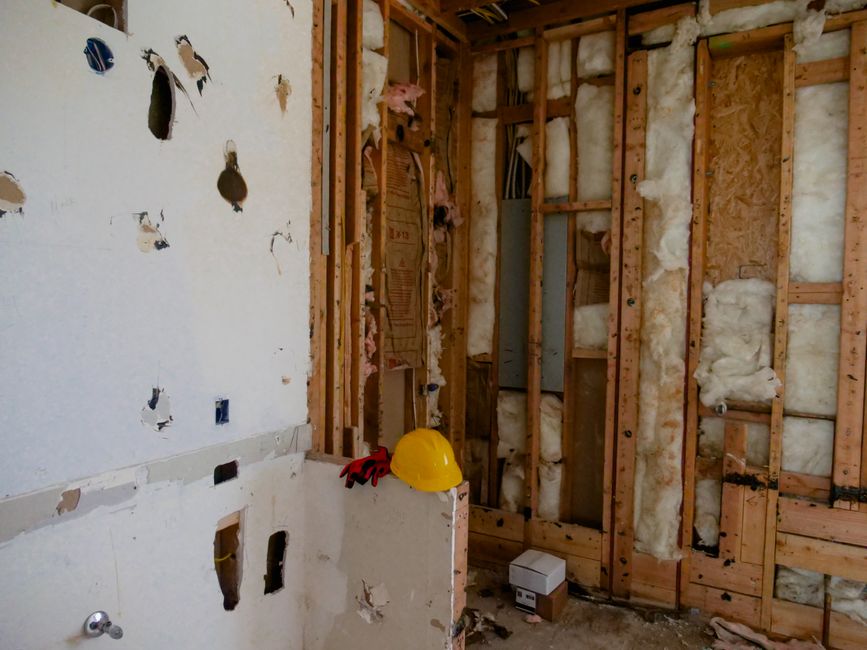 Contractor framing a basement wall